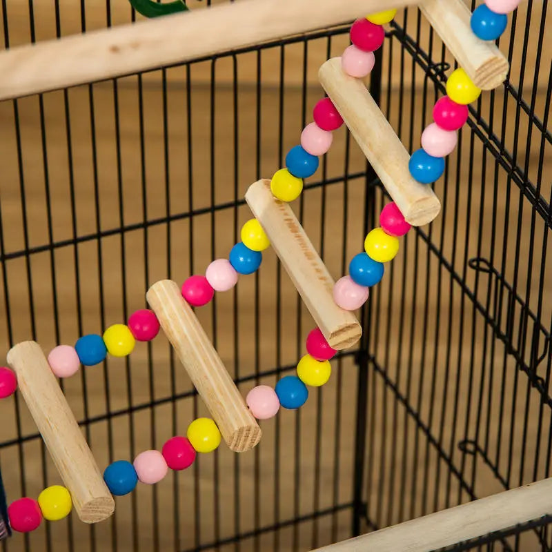 Cage à oiseaux avec accessoires et jouets, détail des jouets