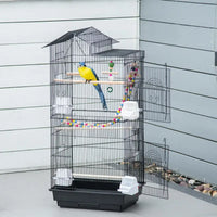Cage à oiseaux avec accessoires et jouets, vue de face
